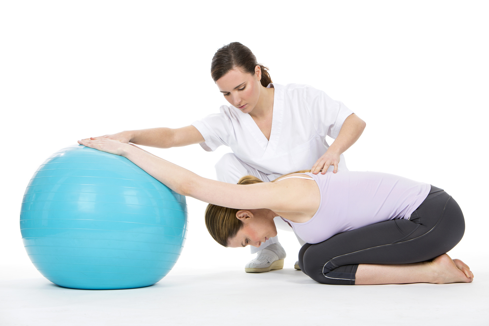 woman with physiotherapist exercising and reinforcing the vertebral column